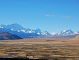 09 Cho Oyu, Nangpai Gosum I, Nangpa La, Jobo Rabzang Early Morning From Across Tingri Plain The view across the plains from Tingri include Cho Oyu (8201m), the pointed peak Nangpai Gosum I (7351m, also called Pasang Lhamu Chuli, Josamba and Cho Aui), the Nangpa La pass between Tibet and Nepal, and Jobo Rabzang (6666m) on the right.